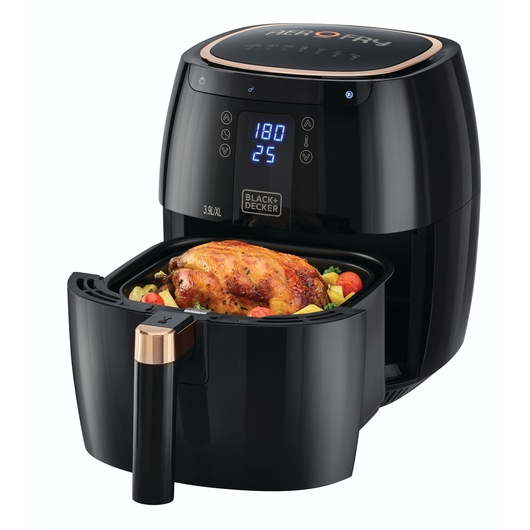 A BLACK+DECKER air fryer with a digital display, showing 180°C and 25 minutes, containing a cooked chicken surrounded by vegetables in its basket.
