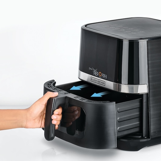 Photo of BLACK+DECKER AF5800 air fryer with hand pulling out basket, front angle on white background.