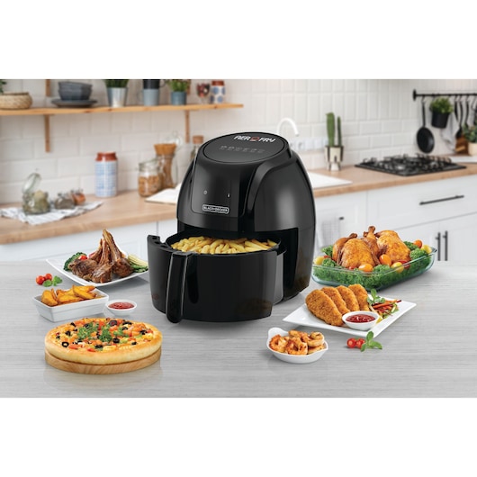 BLACK+DECKER AF625 air fryer on a kitchen counter, shown with fries and various cooked foods.