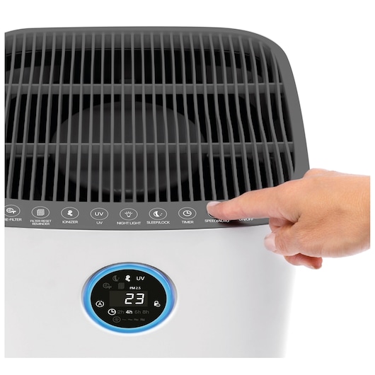 BLACKDECKER AP3560 air purifier front angle, close-up of control panel with hand pressing button.