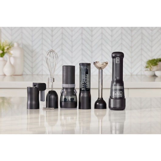 Photo of BLACK+DECKER BCKM1016KSB kitchen multi-tool set with various black and silver attachments on countertop.