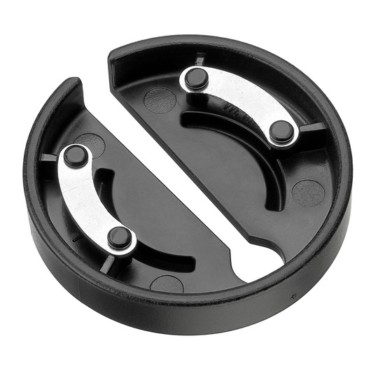 A circular black plastic photography accessory with two curved metal components and a central slot, viewed from above against a white background.