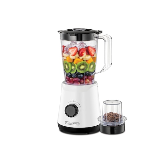 A BLACK+DECKER BX520 blender with a transparent pitcher filled with assorted fruits and ice, displayed next to a small grinder attachment containing coffee beans. The blender is white with a black control dial.