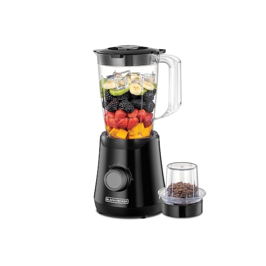 A BLACK+DECKER BX530 blender with a transparent jar filled with assorted fruits and ice cubes, placed next to a small grinder attachment containing coffee beans.