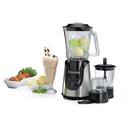 A BLACK+DECKER BX600G blender with a glass jar containing ice cream and ice cubes. Next to the blender are two additional glass containers with black lids, a glass of milkshake topped with whipped cream and wafer rolls, two bowls of food, and some coffee beans.