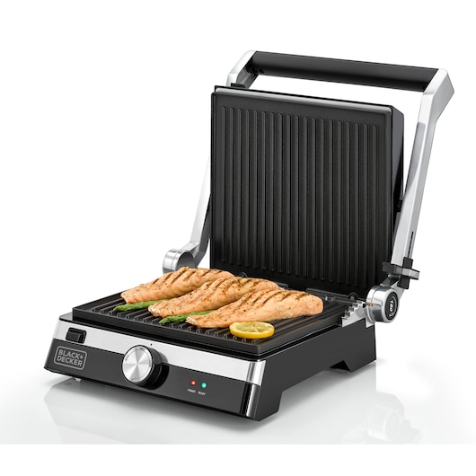 BLACK+DECKER CG2000 electric grill with open lid, grilling chicken fillets, vegetables, and lemon slice, front angle.
