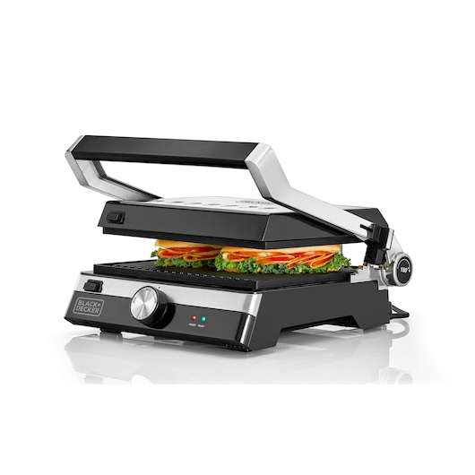 BLACK+DECKER CG2000 silver and black panini press with sandwich, front angle on white background.
