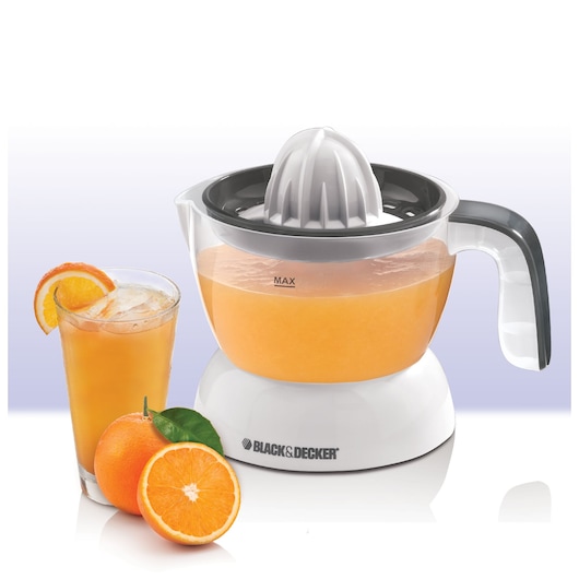 BLACK+DECKER CJ200 electric citrus juicer with clear container, next to a glass of orange juice and fresh oranges, front view.