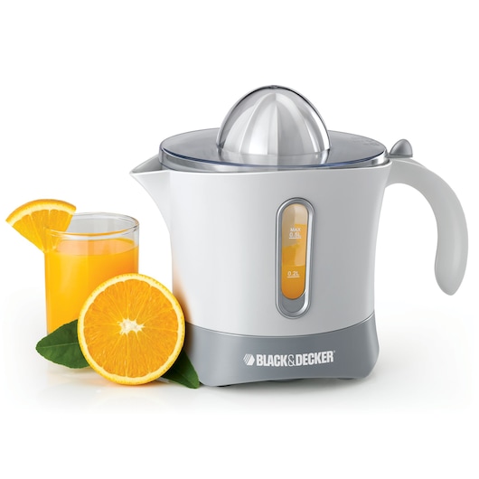A BLACK+DECKER electric citrus juicer, model CJ650, is shown next to a glass of orange juice garnished with an orange slice and a fresh orange cut in half with green leaves. The juicer is white and grey with a transparent lid and indicator window.