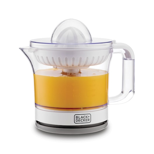 A BLACK+DECKER electric citrus juicer with a transparent container filled with orange juice, white lid and handle, and measurement markings on the side.