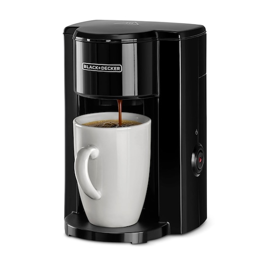BLACK+DECKER DCM25N black single-serve coffee maker front angle with white mug beneath the dispenser.