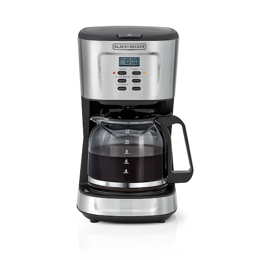 A BLACK+DECKER drip coffee maker with a digital display, several buttons, and a glass carafe filled with brewed coffee. The machine has a stainless steel and black finish.