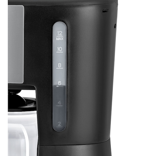 Close-up view of a BLACK+DECKER coffee maker showing the water level indicator on the side, marked with measurements from 2 to 12 cups.