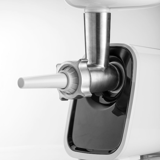 BLACKDECKER FM1500 electric meat grinder with sausage attachments, side angle on white background.
