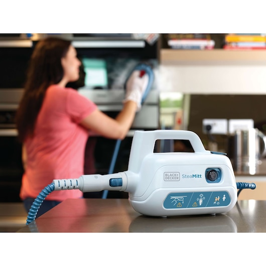 BLACK+DECKER FSH10SM steam cleaner with hose and control panel, kitchen setting, product foreground.