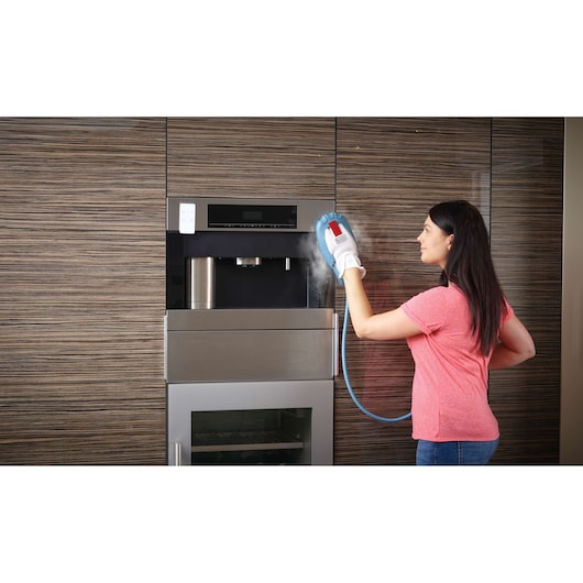 BLACKDECKER FSH10SM steam cleaning glove in use on kitchen appliance, product category Photography.