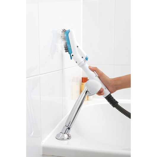 BLACKDECKER FSMH13151SM steam cleaner with brush attachment cleaning white bathroom tiles.