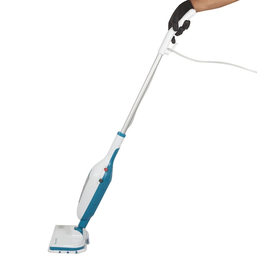 BLACK+DECKER FSMH13E5 steam mop with white and blue body, side angle, person holding handle.