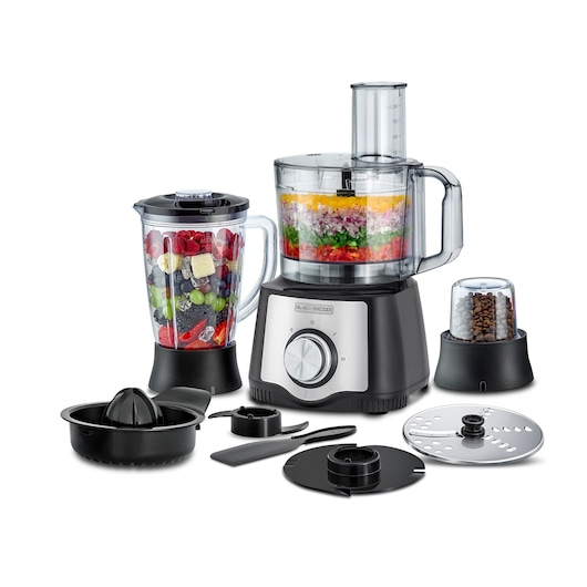 A BLACK+DECKER FX650 multifunction food processor set displayed with its various accessories. The main processor has a clear bowl filled with layered chopped vegetables, a blender jar containing mixed fruit and ice cubes, a coffee grinder with coffee beans, a citrus juicer attachment, and several blades and discs arranged in front, all shown on a white background.
