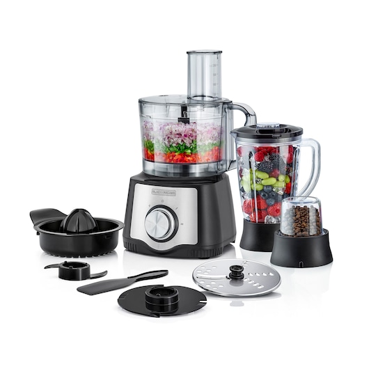 A BLACK+DECKER food processor set including the main unit with a dial, a blender jar filled with assorted fruits, a grinder jar with coffee beans, a citrus juicer, and several interchangeable blades and attachments. The food processor bowl contains chopped vegetables.