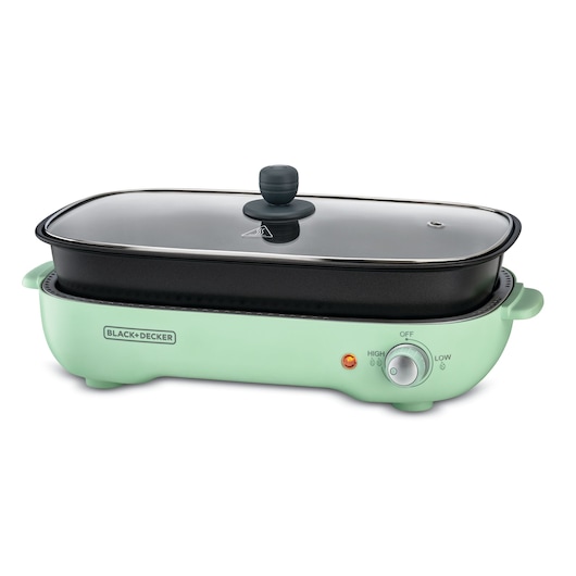 A BLACK+DECKER electric cooker with a mint green base and a rectangular black cooking pot with a glass lid.