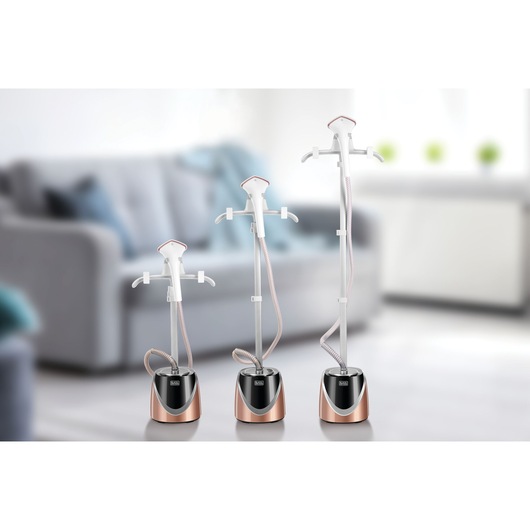 BLACKDECKER GST1600 garment steamers in three heights shown in a modern living room setting.