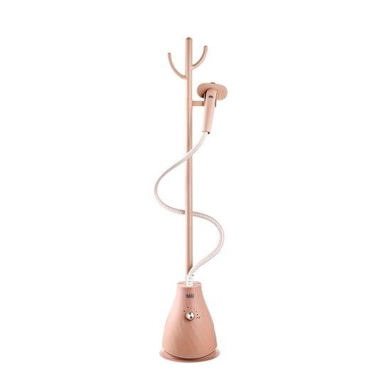 A pink upright garment steamer with a base on the floor, a long pole, and a hose connected to a handheld steam nozzle. The BLACK+DECKER logo is visible on the steamer base.
