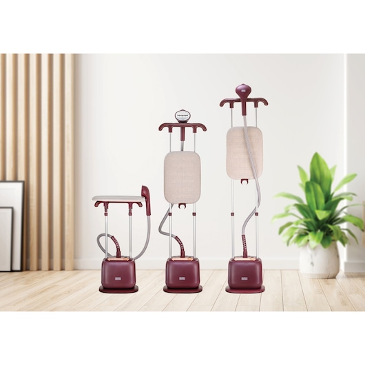 BLACK+DECKER GSTD2450 garment steamer in burgundy, three units shown at different heights, in a modern room.