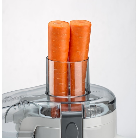 BLACKDECKER JE250 juicer feed chute with two whole carrots, front angle, white background.