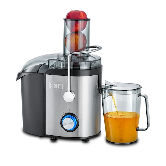 A BLACK+DECKER JE800 electric juicer with stainless steel and black housing, shown juicing apples. A transparent container is collecting freshly squeezed orange juice.