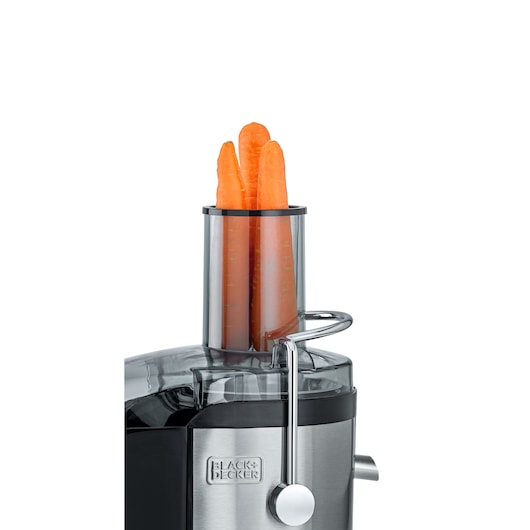 Photo of BLACK+DECKER JE800 juicer with whole carrots in the feeding tube, front angle on white background.