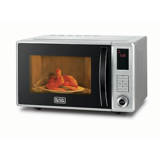 A BLACK+DECKER microwave oven with a digital control panel and a plate of food inside, visible through the front window.