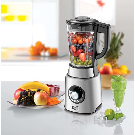 BLACK+DECKER PB120 blender with stainless steel base, filled with assorted fruits and ice, shown on kitchen counter.