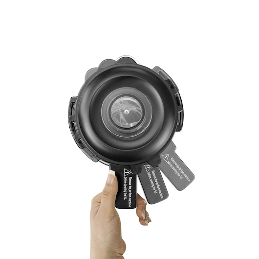 BLACKDECKER PB120 circular black vacuum filter held by a hand, white background, top view.