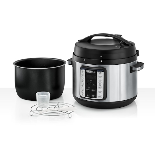 A BLACK+DECKER electric pressure cooker with a digital control panel, detachable inner pot, measuring cup, metal rack, and plastic spoon displayed together on a white background.