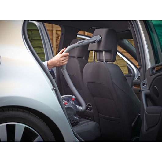 BLACKDECKER PD1200AV handheld vacuum cleaning car seat with hose attachment, interior view.