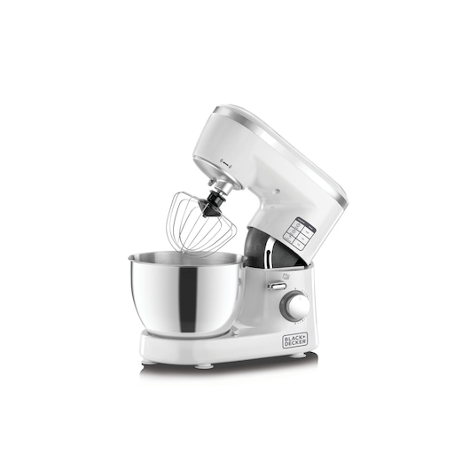 A BLACK+DECKER stand mixer, model SM1000, featuring a white body and a stainless steel mixing bowl. The mixer head is tilted back, showing the wire whisk attachment.