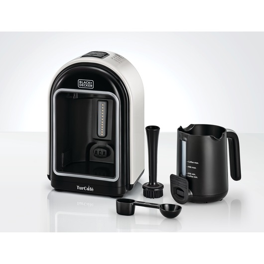 BLACK+DECKER TCM730 Turkish coffee maker with included accessories such as serving pot, measuring spoon, mixing and cleaning tools, displayed on a white surface.