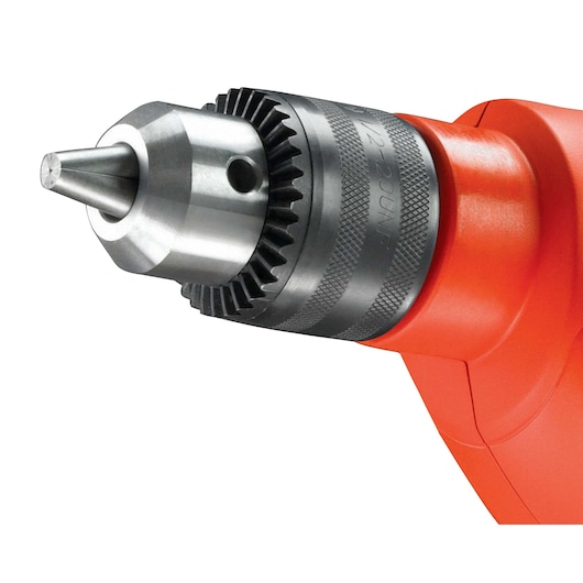 Close-up of the chuck and metal tip of a BLACK+DECKER orange-colored power drill.
