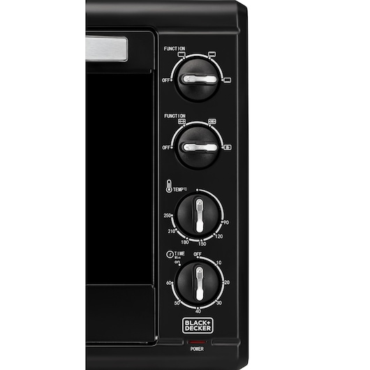 Photo of BLACK+DECKER TRO55RDG oven control panel with four black dials and white markings, front angle.