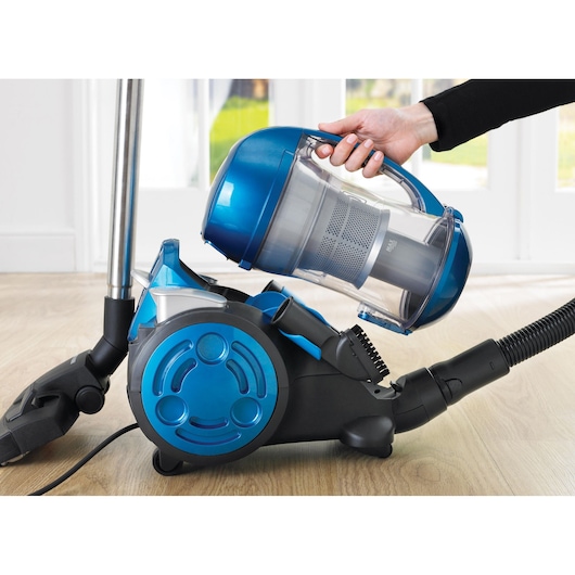 BLACKDECKER VM2825 canister vacuum cleaner with blue and black color, shown with removable dust container.