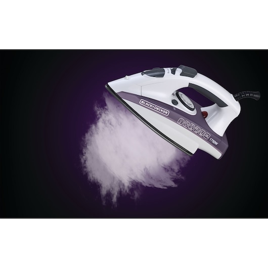 Photo of BLACK+DECKER steam iron X1750 angled, white and purple, releasing a burst of steam on dark background.