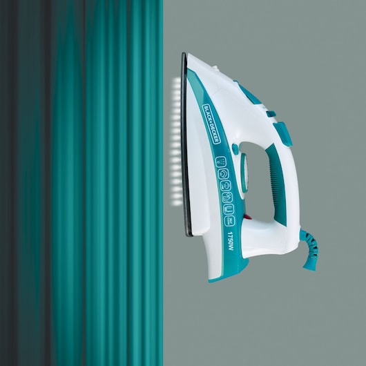 BLACK+DECKER X2000 steam iron with teal and white design, side view, pressing teal fabric.