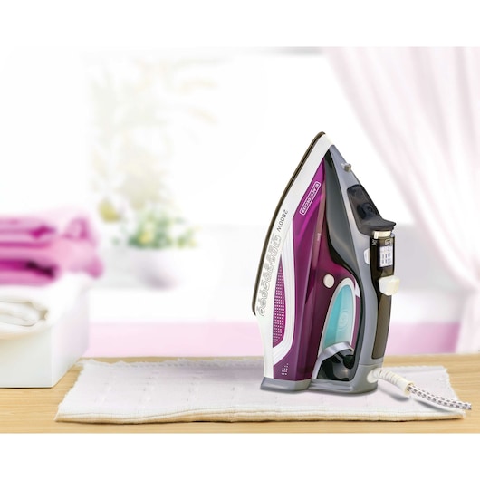 Photo of BLACKDECKER X2250 purple steam iron on white background, product standing upright, Photography category.